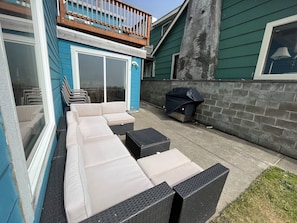 Comfy outdoor space with ocean view and a new Natural Gas BBQ!