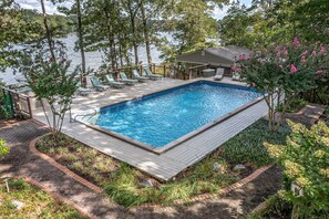 20ft x 40ft inground pool from 3-8ft deep, 1320 sq. ft. pool deck w/ bar.