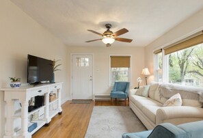 Cozy living area with comfy couch, smart TV with Netflix, HBO Now, and Disney +.