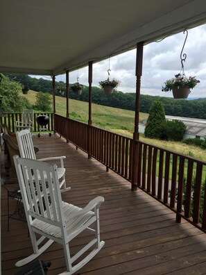 Wrap around porch in the Manor House. There is a fir-pit just below.