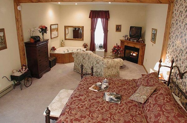 One of the bedrooms in the Manor House. The rooms have a jacuzzi and fireplace 