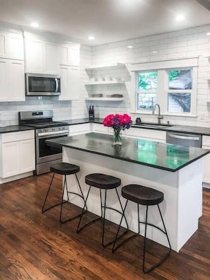 open concept kitchen - opening to dining area and tv room