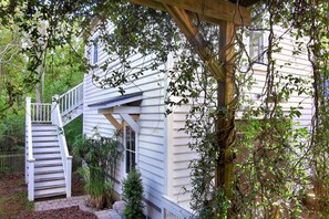 Stairs lead to the deck and apartment entry