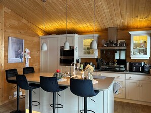 the modern kitchen with an island table bar 
