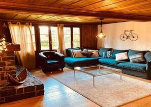 spacious living room with a warm fire place 