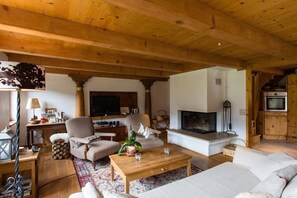 the beautiful living room with a warm fire place 
