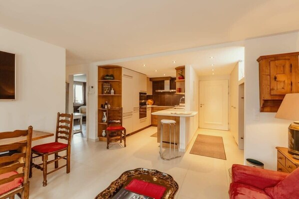 view of the living room with charming open kitchen 