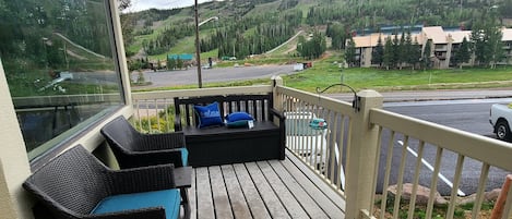 Patio with seating and views of the slopes