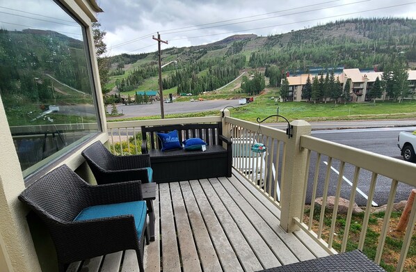 Patio with seating and views of the slopes