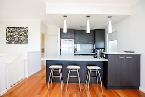 The well equipped kitchen includes dishwasher and Nespresso coffee pod machine