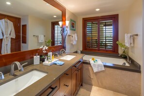 Master Bathroom with soaking tub, walk in shower, and double vanities. 