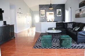 View from the living room showing the open dining room and main entrance