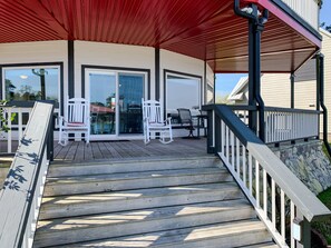 View of the back porch with large deck and plenty of seating