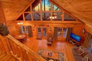 Loft View of the Spacious Living Room w/Gorgeous Huge Window Views of Mountains 