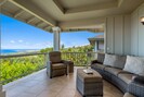 Take in breathtaking Kailua Bay from comfortable furniture on the balcony.