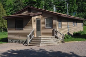 Front Exterior and cabin entry and large parking area for AVT, Snowmobile or Boat trailers.