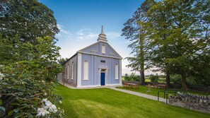 Leafy grounds with sea views