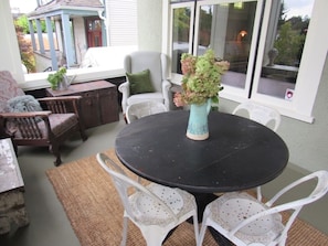 Dining area on shared front porch. 