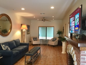 Living room- large smart TV, pull-out sofa bed. comfortable furniture.
