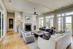 Large open and bright living room with lots of comfortable seating. Enjoy the marsh views through the large patio doors.
