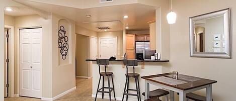 Dinning room *table had been changed out to a lower wooden table w/ cushion seats for comfortability*