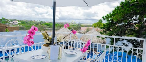 Balcony overlooking the ocean and the pool deck.