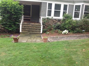 Stairs to covered porch and front door