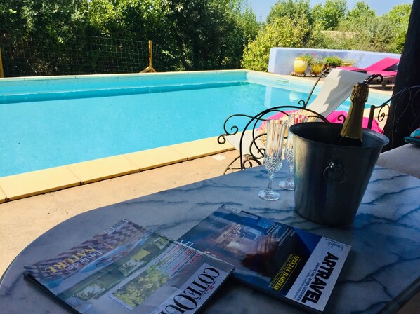 10 x 5 meter tiled, gated swimming pool with shade, summer kitchen and day beds