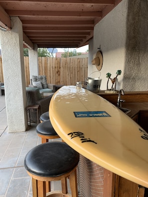 Outdoor surfboard bar for cocktails and dining al fresco!