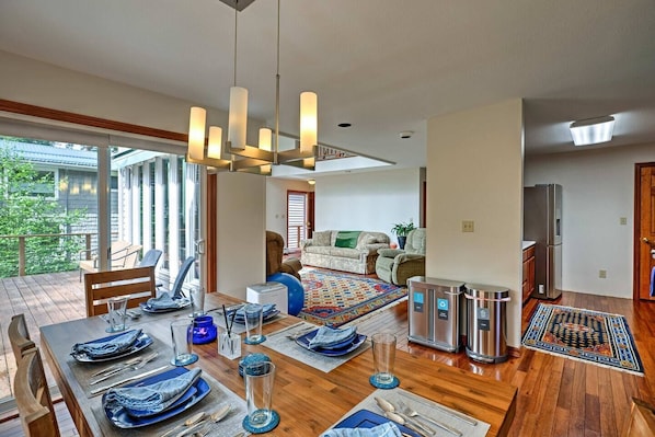 The dining area is central to the kitchen and living area. It also opens straight out to the deck views