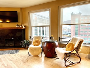 Living room with smart TV and views of the "M" trail on Mount Sentinel.