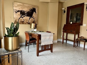 Dinning nook for two and desk on the right that folds out for use. 