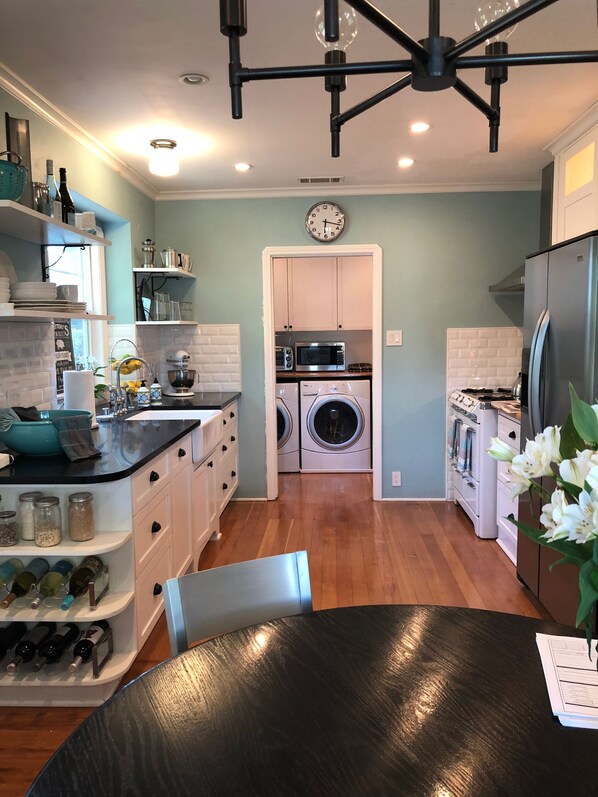 Fully-stocked kitchen w vintage O'Keiff & Merritt stove, washer and dryer, etc.