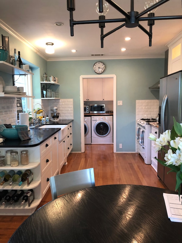 Fully-stocked kitchen w vintage O'Keiff & Merritt stove, washer and dryer, etc.