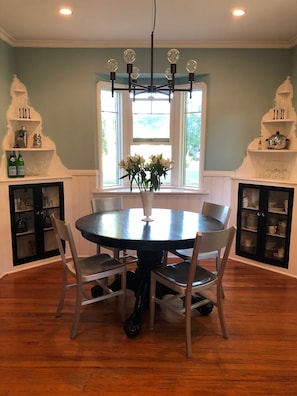 Dining table expands to seat up to 8 and overlooks serene historic neighborhood.