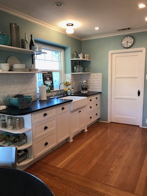 Kitchen includes all dishes, cooking supplies and dishwasher, roomy workspaces.