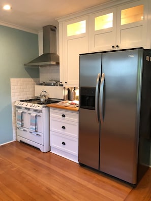 Kitchen with full-size refridgerator.