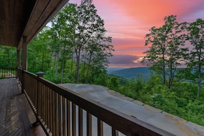 Night time sunsets are yours. The back deck 10 seat table, swings, & more
