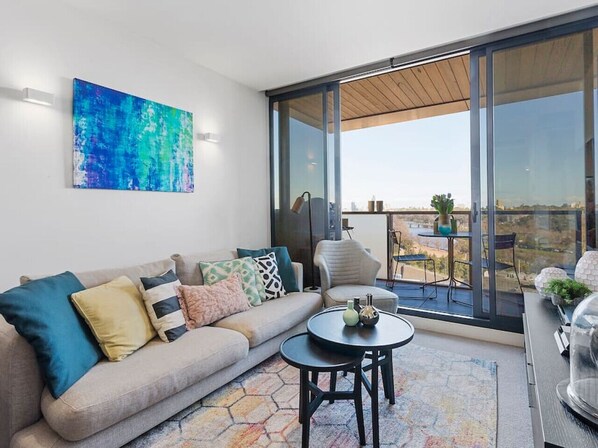 Comfortable lounge area opening up onto a balcony with amazing views