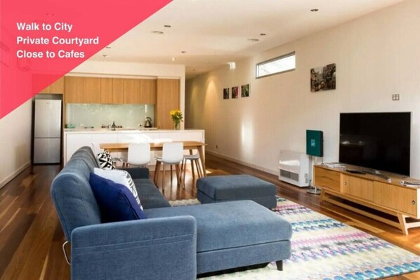 [Living Room] Surely you can relax on a comfy sofa in this bright, modernly furnished living room.