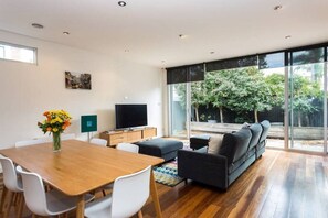 Open-plan living/lounge which opens onto private courtyard