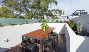 A stunning private rooftop terrace lets you get fresh air while enjoying the sun.