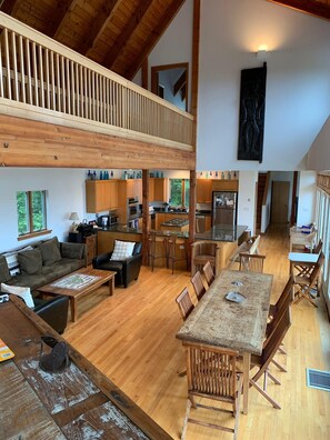 living/dining room area with large dining table and large couch