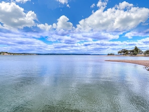 Fresh air, big sky, and lake views await! This photo was taken from the dock. The beach to the right is in front of the main house. Please note: The water level fluctuates; sometimes there is a beach, and sometimes there is not!