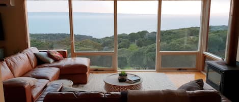 Open plan living dining kitchen area with spectacular views over the coast