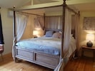 Huge master bedroom with 4 poster, r/c aircon, fan & screened doors out to deck