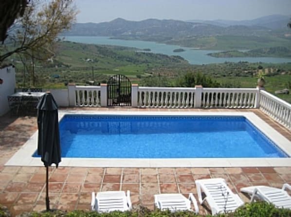 Relax by the private pool with amazing views over Lake Vinuela.