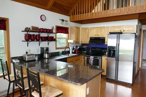 Open kitchen with bar seating