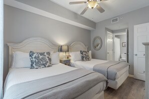 Guest room with 2 full beds & en suite—perfect for families or friends to share.