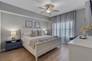 Primary bedroom with king bed—spacious comfort for your beachside retreat.